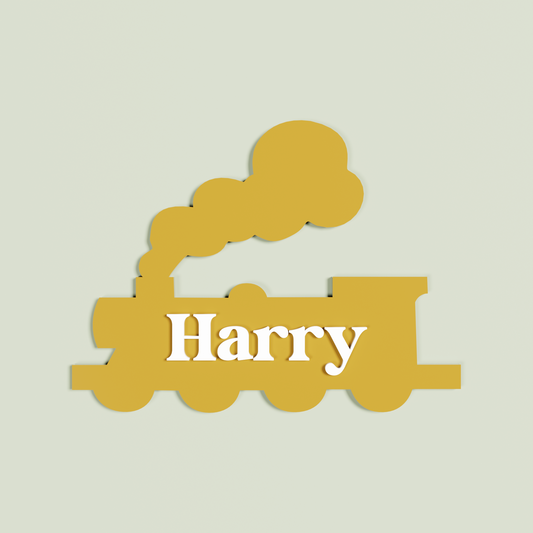 Double Layered sand train-shaped name plaque with 'Harry' in white| Saint Sauvant Auckland NZ
