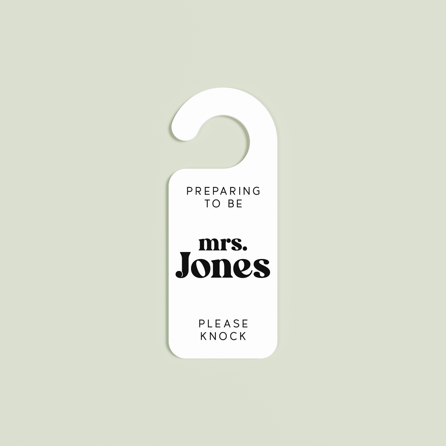 White Alba door hanger with 'Preparing to be mrs. Jones please knock' black text | Saint Sauvant Auckland NZ