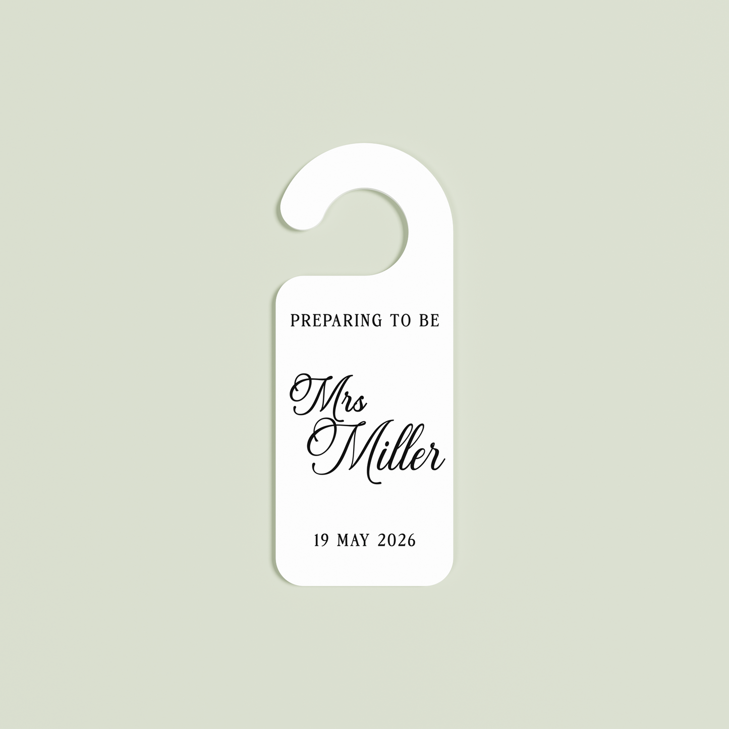 White Promesse door hanger with 'Preparing to be Mrs Miller 19 May 2026' black text | Saint Sauvant Auckland NZ
