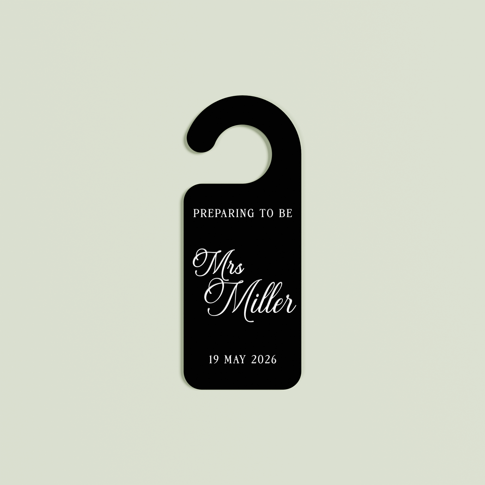 Black Promesse door hanger with 'Preparing to be Mrs Miller 19 May 2026' white text | Saint Sauvant Auckland NZ