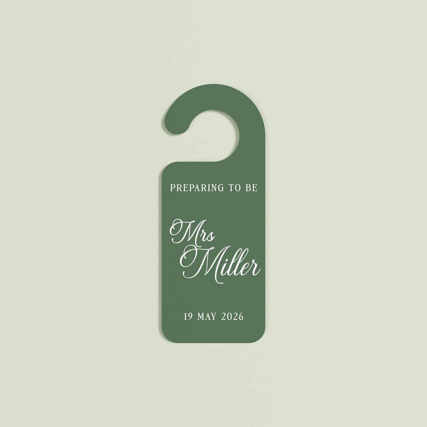 Sage Promesse door hanger with 'Preparing to be Mrs Miller 19 May 2026' white text | Saint Sauvant Auckland NZ