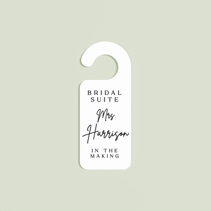 White Velo door hanger with 'Bridal Suite Mrs Harrison In The Making' black text | Saint Sauvant Auckland NZ